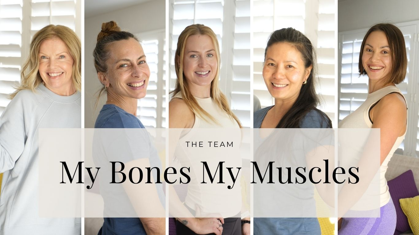 Group photo of the My Bones My Muscles coaching team—five women smiling in natural light, standing in front of white shutters.
